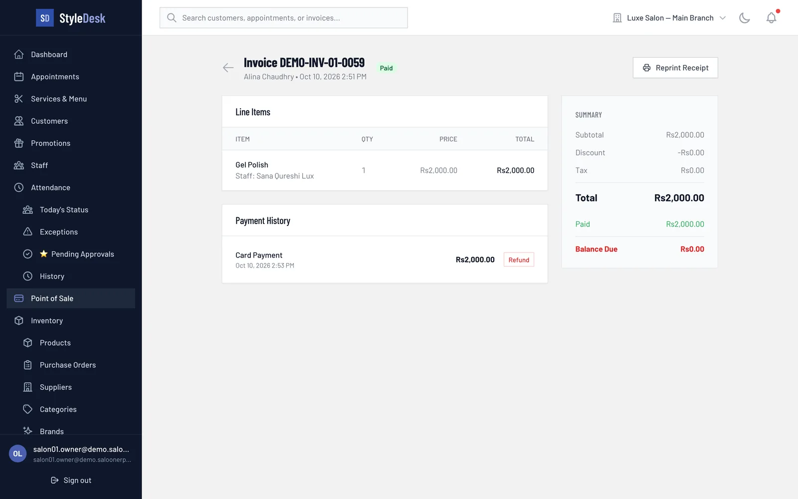 A paid StyleDesk invoice showing the service, the stylist who did it and the card payment